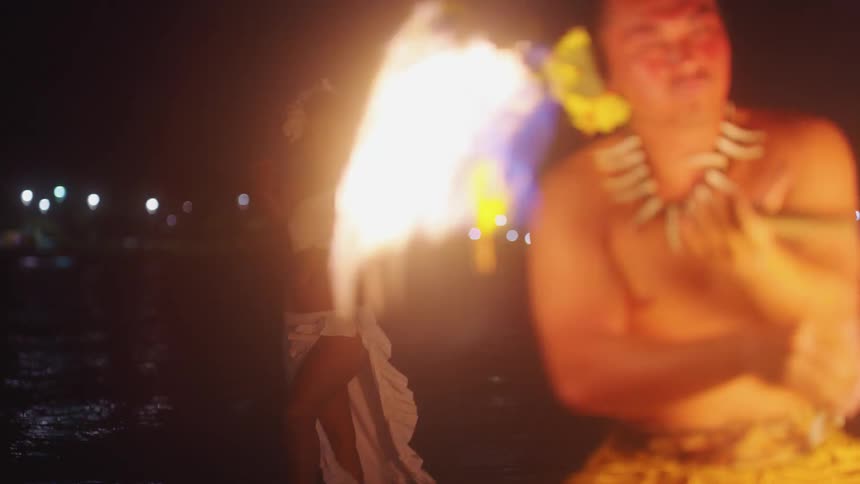 A man and woman are performing outdoors