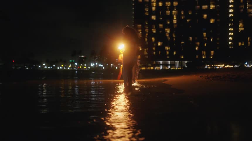 A man flips flames around his body