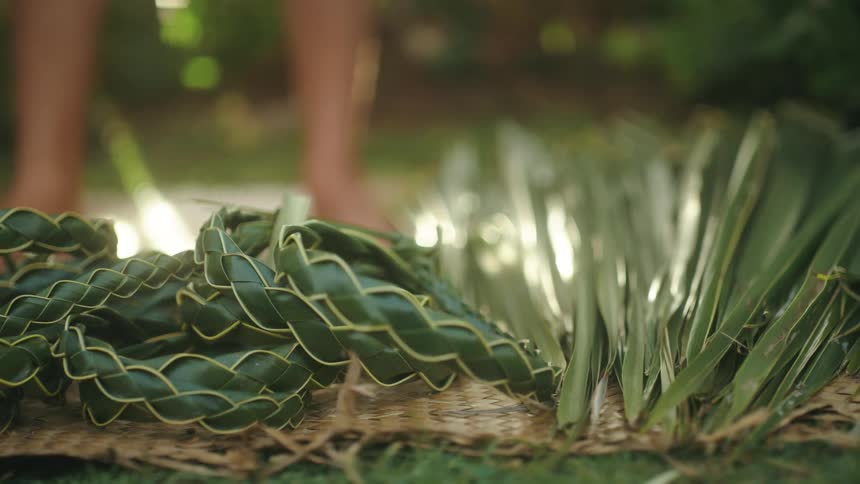 A man sets down a woven headband