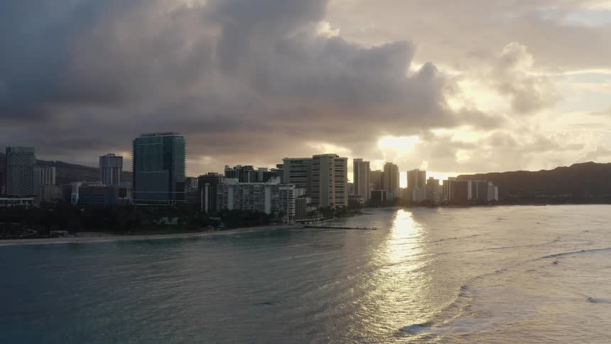 City skyline with tall buildings at sunset