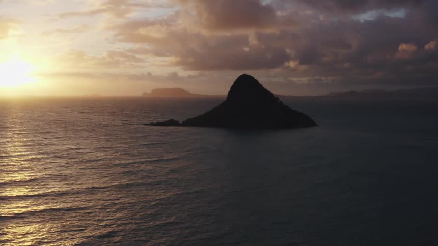 Island on the sea at sunset