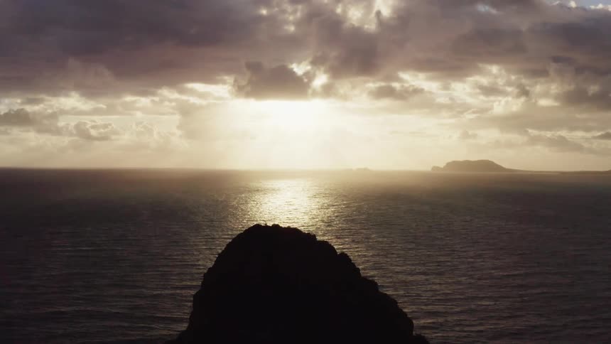 The sun sets on an ocean horizon
