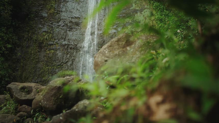 A thin waterfall down a sheer rock face