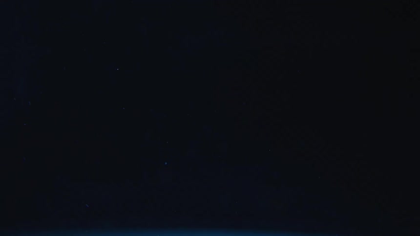 Particles floating on dark liquid
