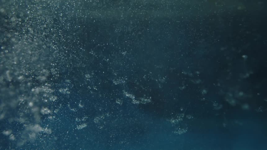 Air bubbles goes down in the water