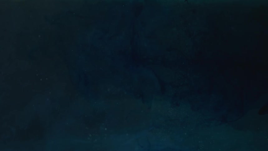 Black ink floating on water