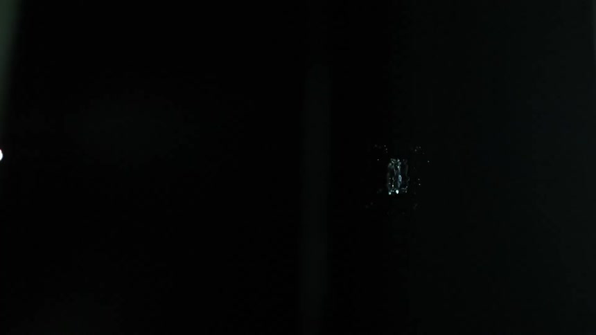 Two water droplets flow horizontally and collide