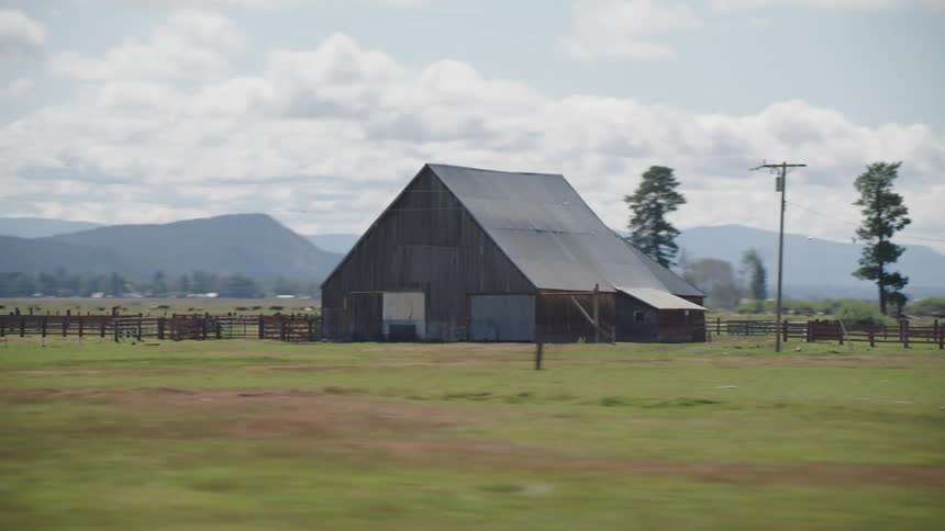 A farmhouse sits on land