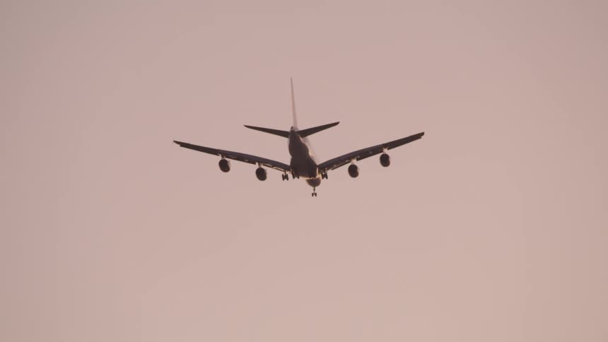 Jet plane overhead with landing gear down