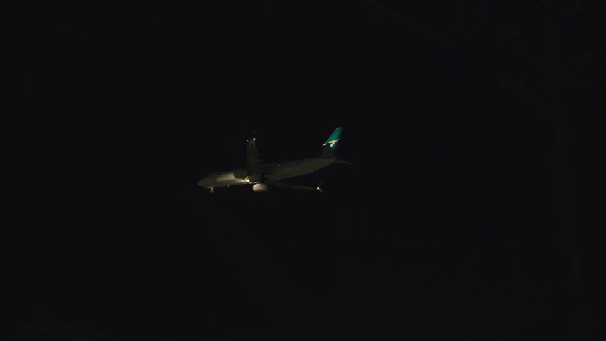 An airplane flying at night