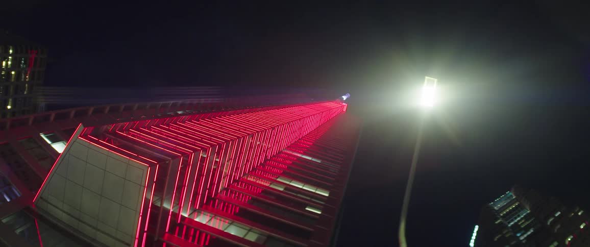 The building is lit pink
