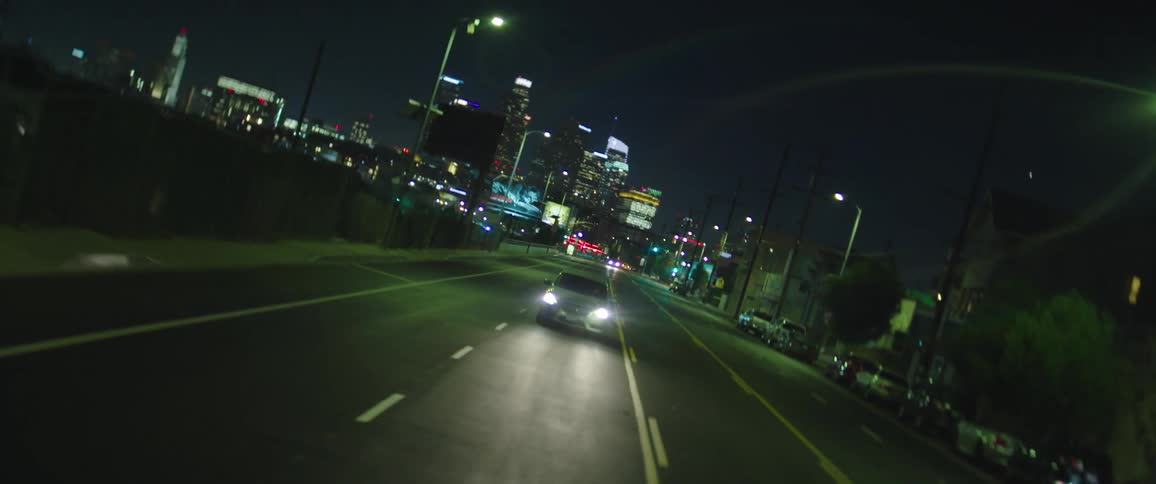 A car drives down the road