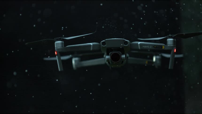 A drone flying in the air in the rain