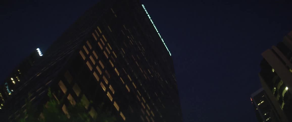 Illuminated skyscraper in the city at night