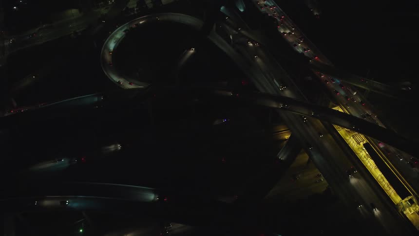 Traffic on city highway interchange at night