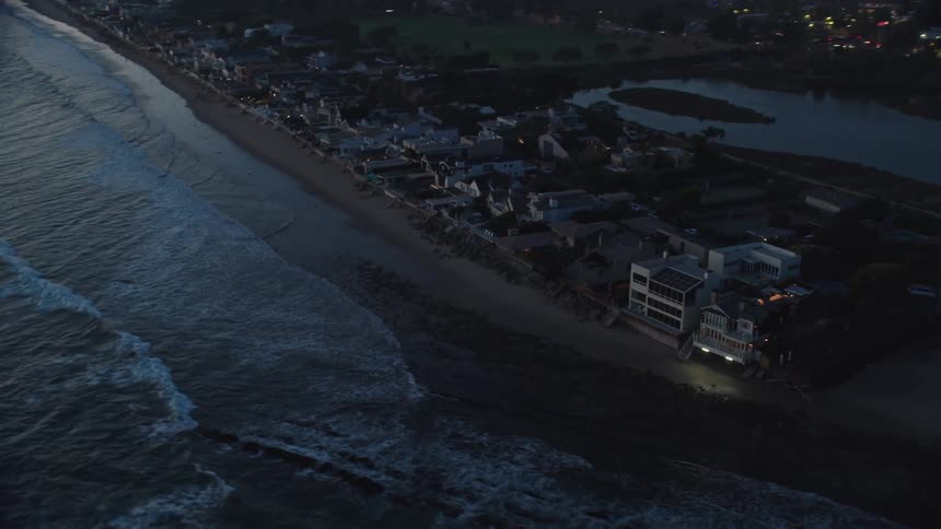 The houses are all lining the beach