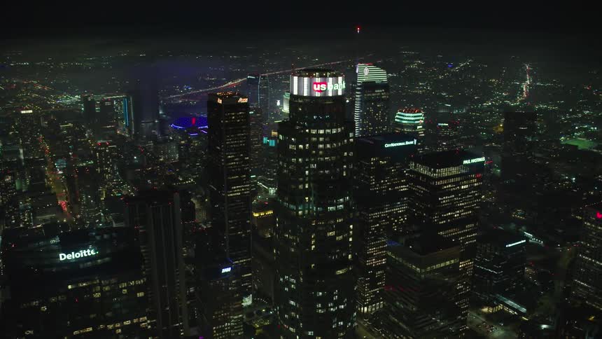 A skyscraper in a metropolis at night