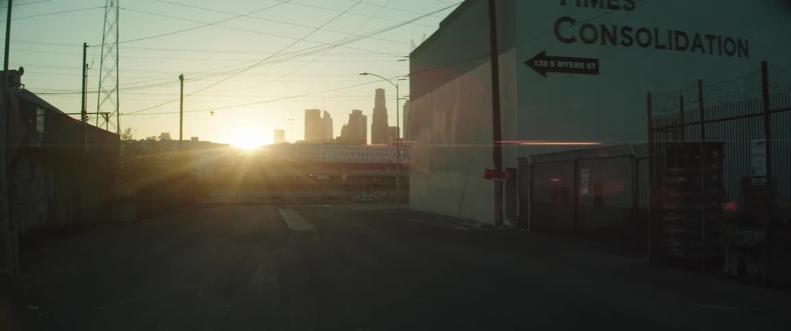 A low sun shining over empty city streets