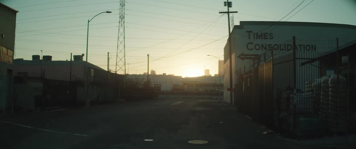 Buildings and streets are empty while the sun is setting