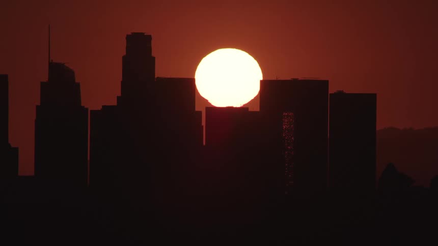 The sun above the buildings