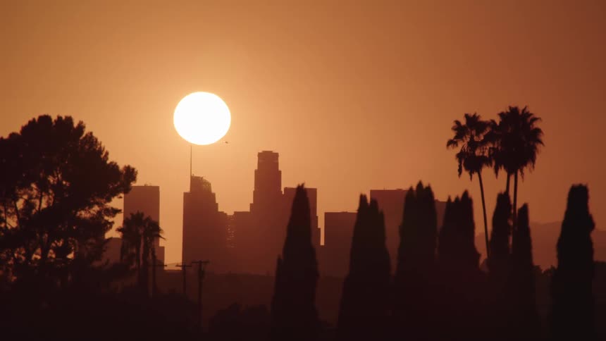 The sun over skyscrapers