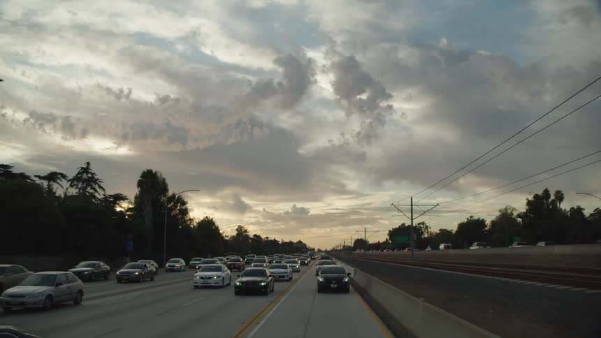 Vehicles driving down a busy freeway