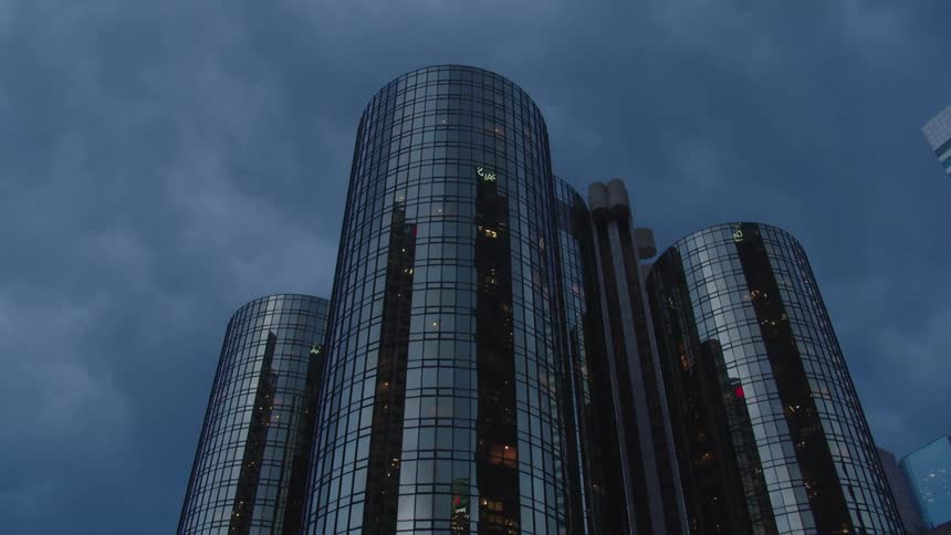 A city with buildings and trees with the sky above