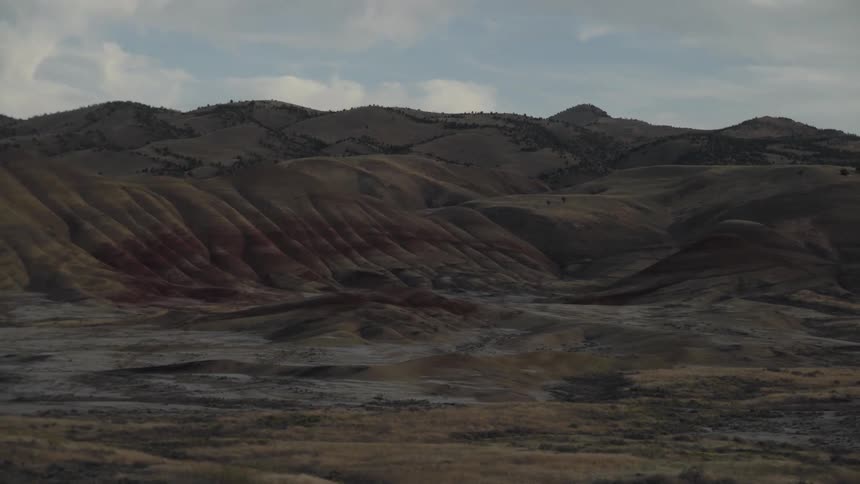 A hilly brown and gray landscape with little vegetation