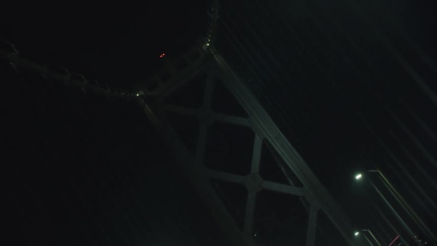 The bridge is brightly lit at night