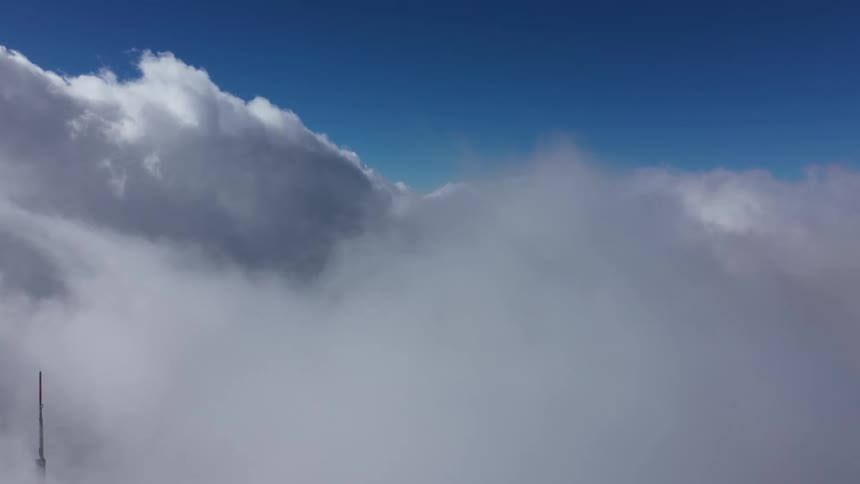 Clouds move below obscuring the ground