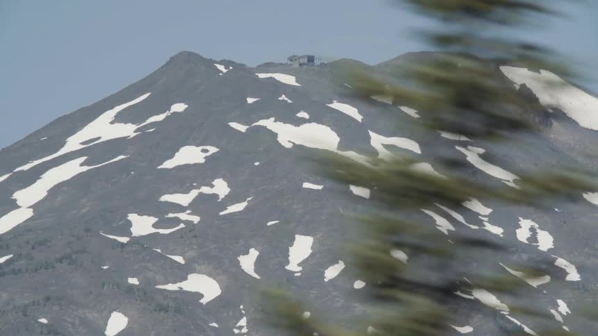 A building sits on top of a mountain