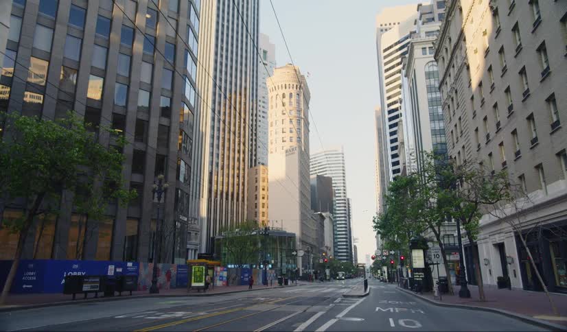 A city street with trees and buildings