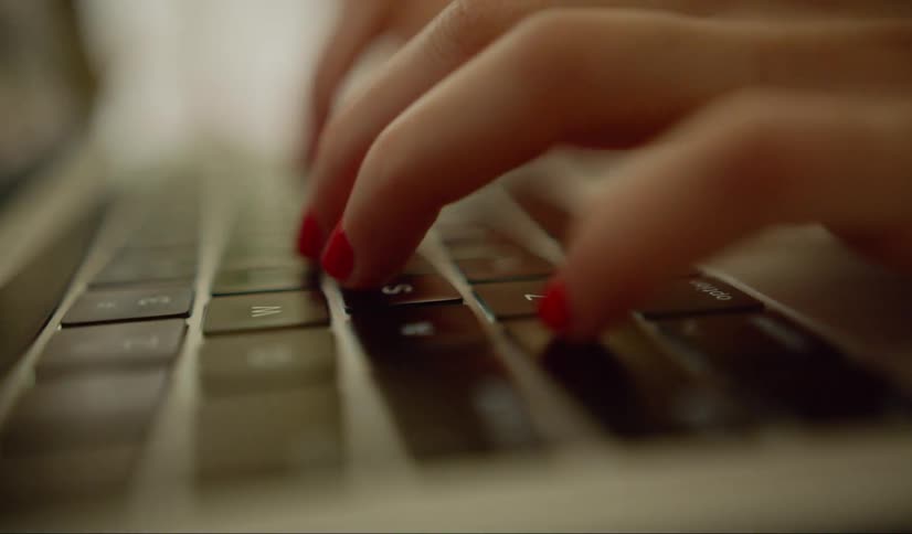 The woman types on the keyboard