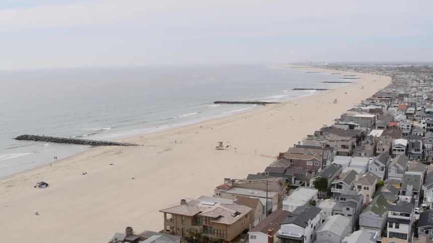 The homes are lined on the beach together