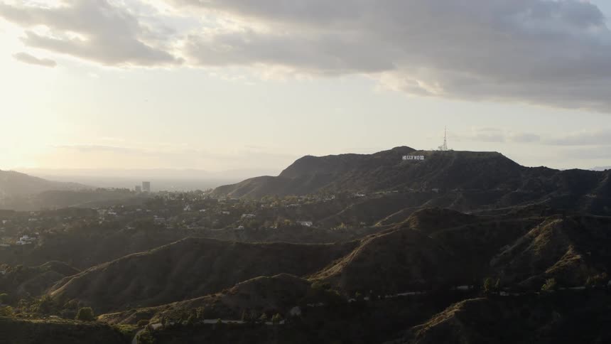 The hollywood sign shows in the distance