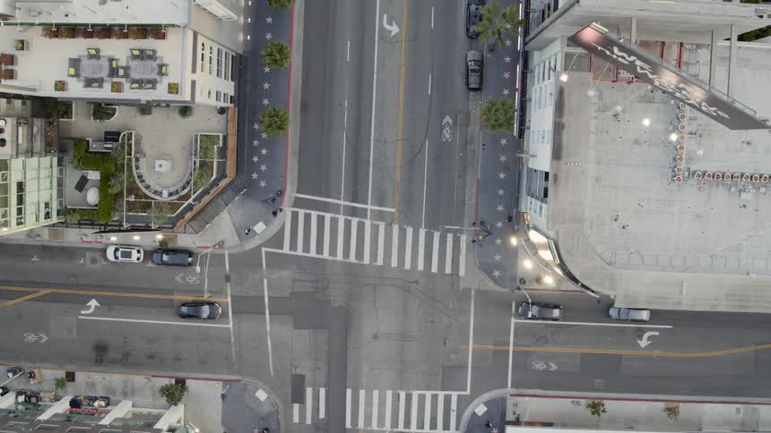 The car makes a turn in the empty intersection