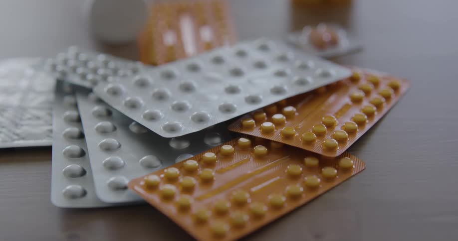 Packages of pills on a table
