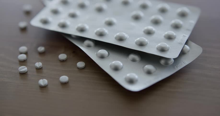 Pills sit on a table