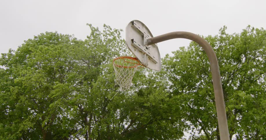 Basketball hoop in public park at day