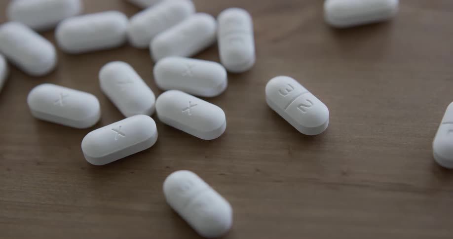 Pills spilled over table