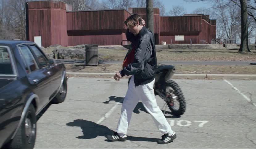 An upset man gets an automatic rifle from his vehicle and goes to confront something