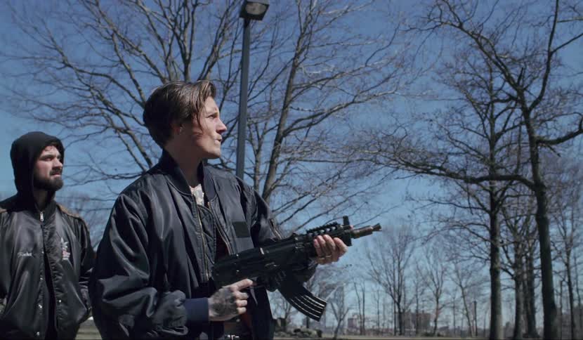 A man fires a gun