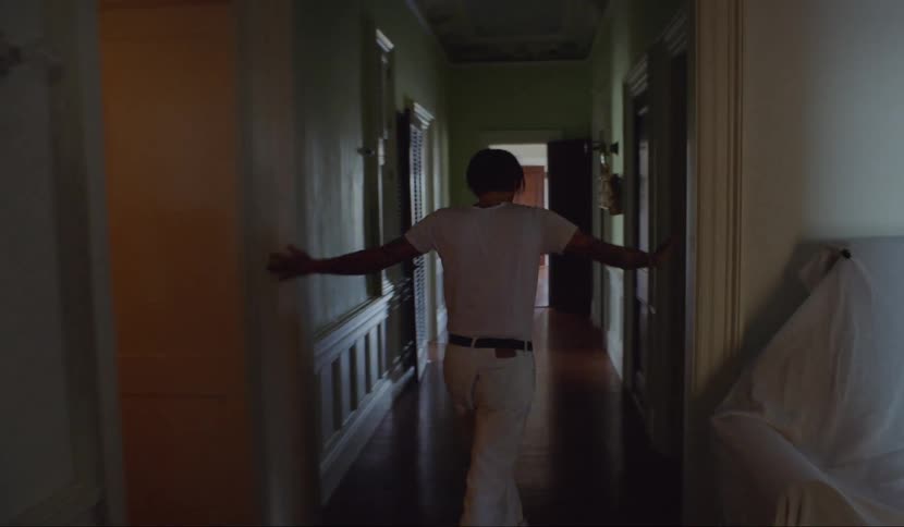 A man wanders the halls