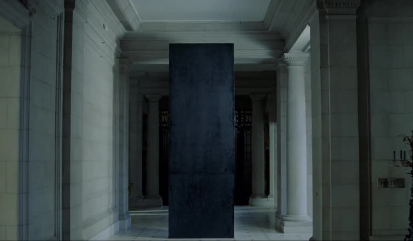 A black monolith in a hallway