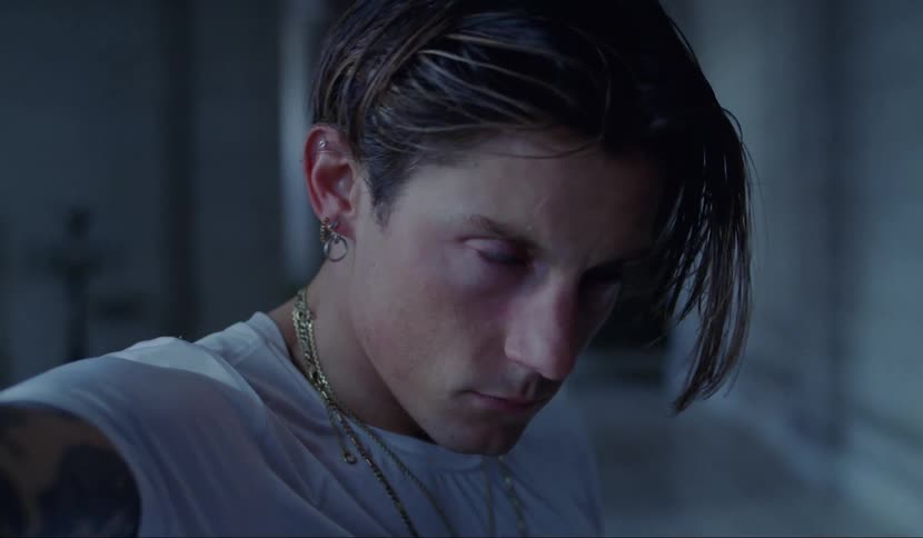 A man is shaking and looks possessed by something