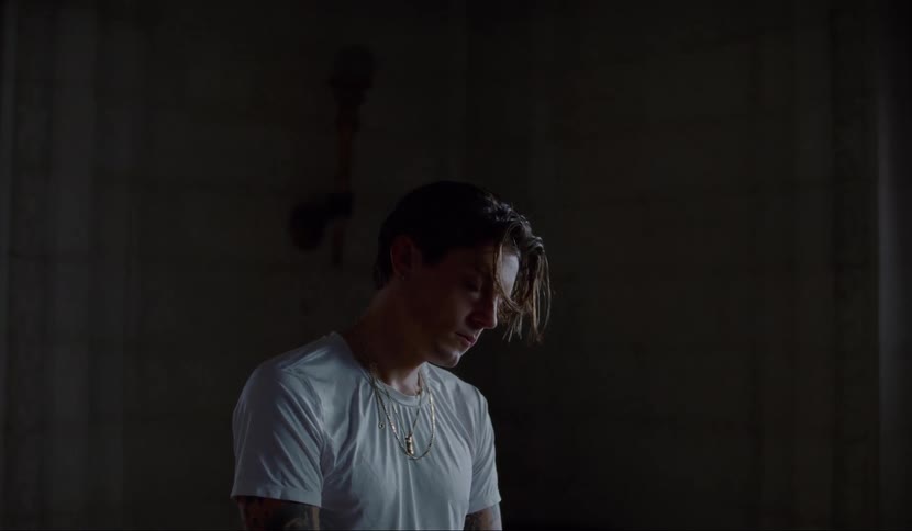 A man stares blankly