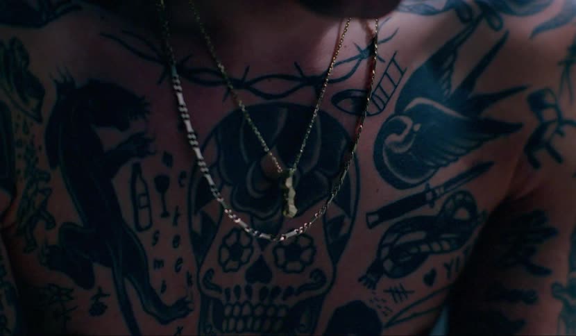 The chest of a tattooed man