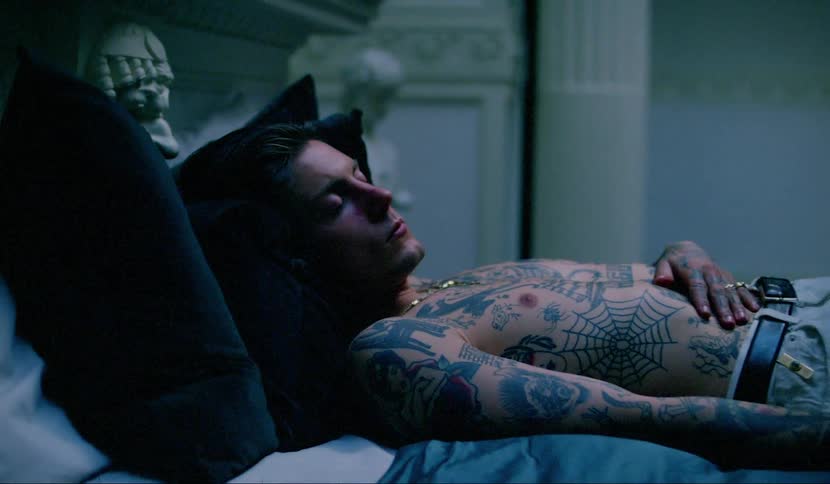 Light shines on a man laying in bed