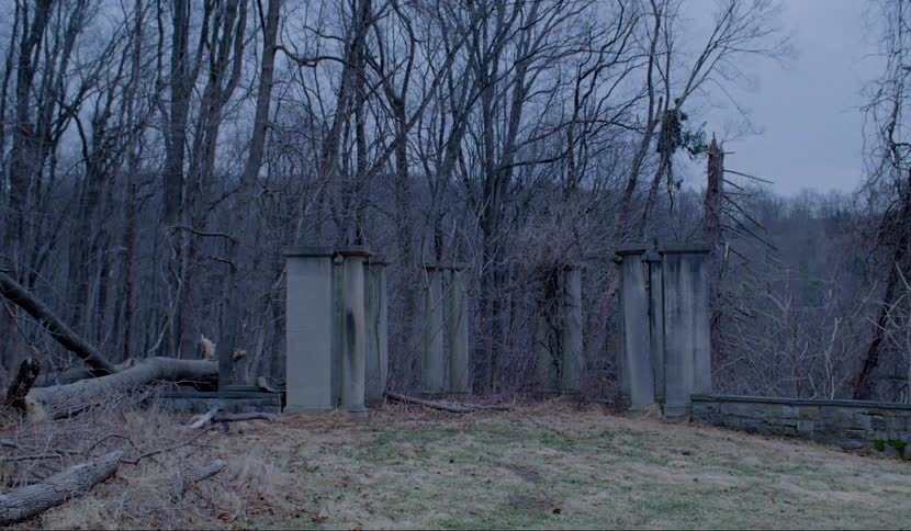 Columns of the ruins in the forest on a cloudy day