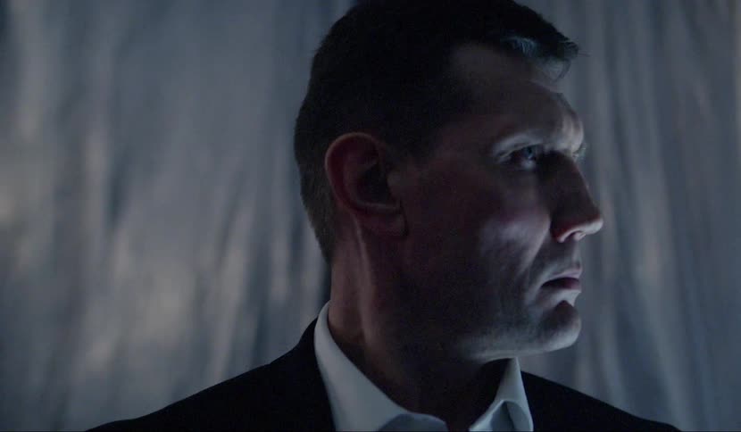 A man standing and staring off into the distance